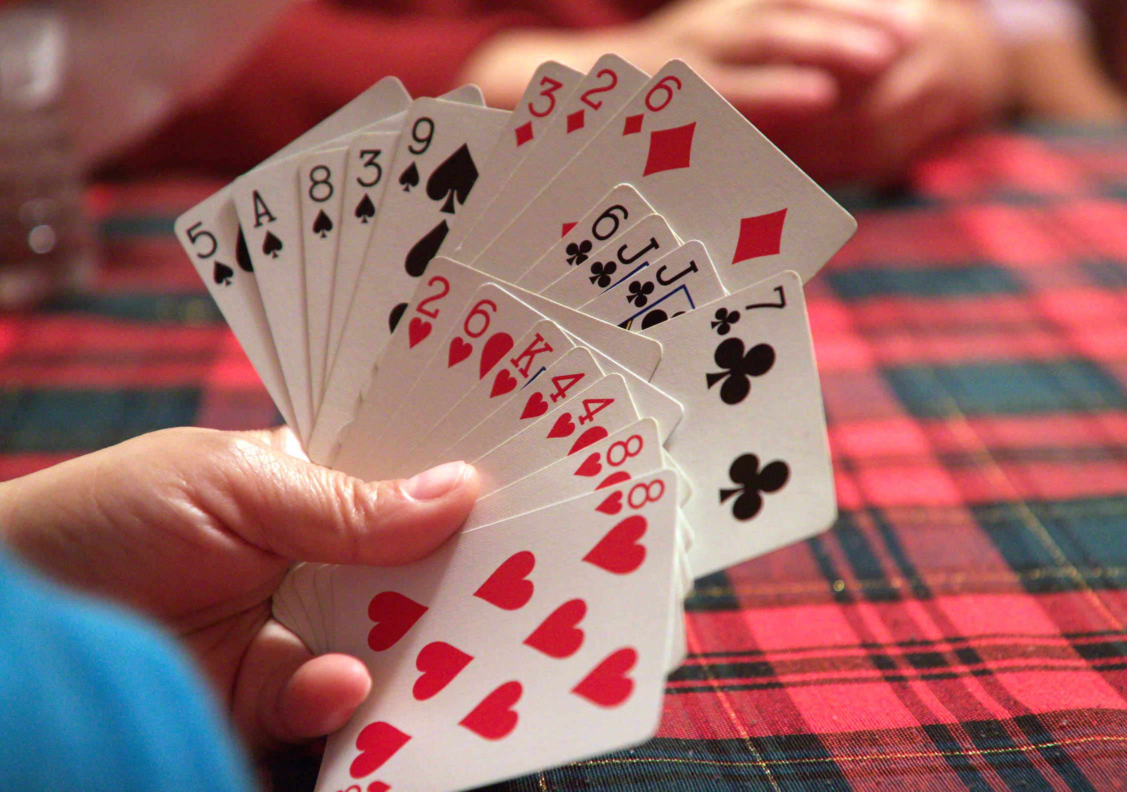 Group laughing at card game